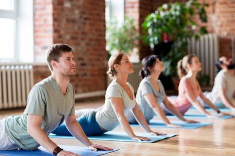 Group of people practising yoga
